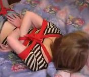 Girl tied in the bed